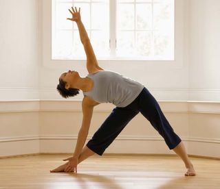 Nude yoga stretching exercises