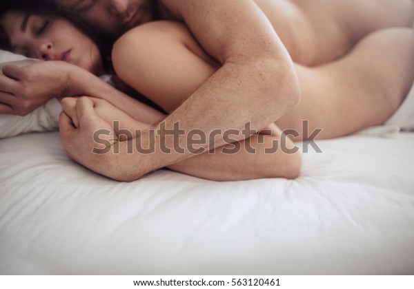 Man and women on bed having sex