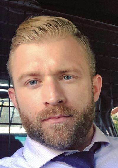 Man with blonde hair and scruffy beard