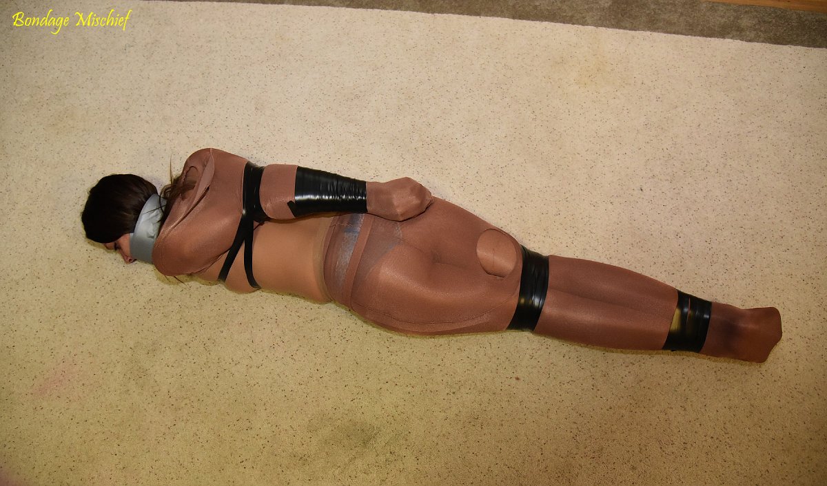 Tape gagged encased in pantyhose