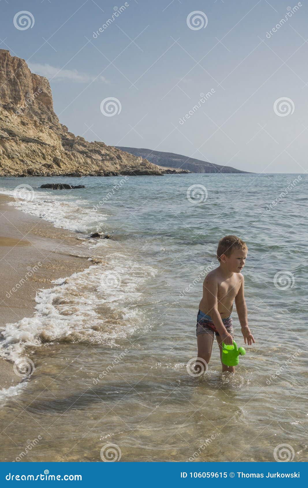 Naked boy on nude beach