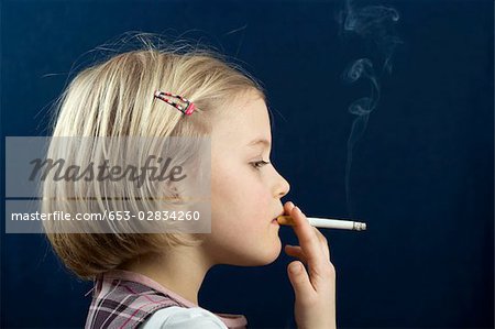 Young blonde teen smoking cigarette