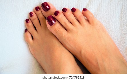 Young feet with painted toenails