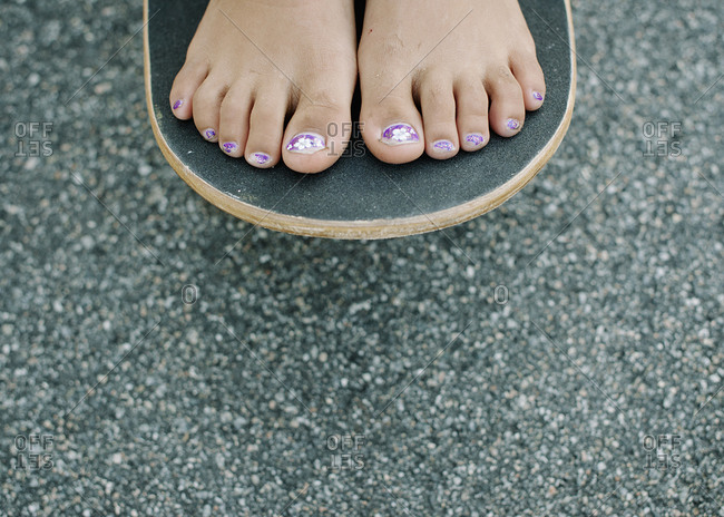 Young feet with painted toenails
