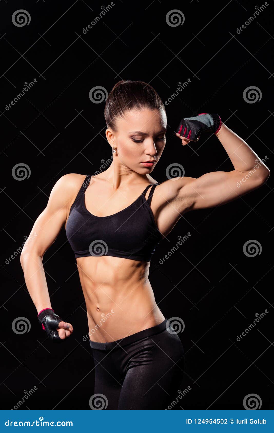 Teen muscle girl flexing biceps