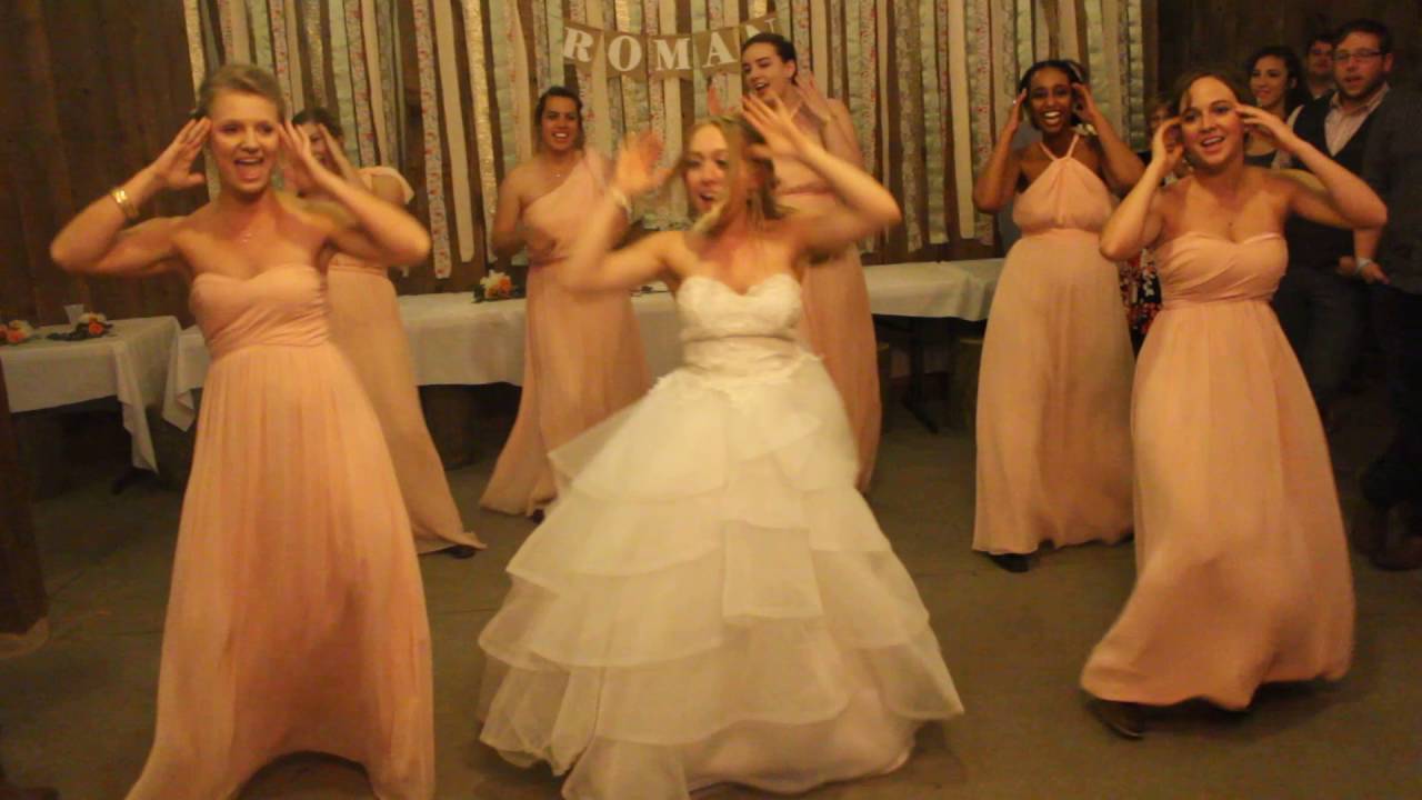 Bride and bridesmaid flashing